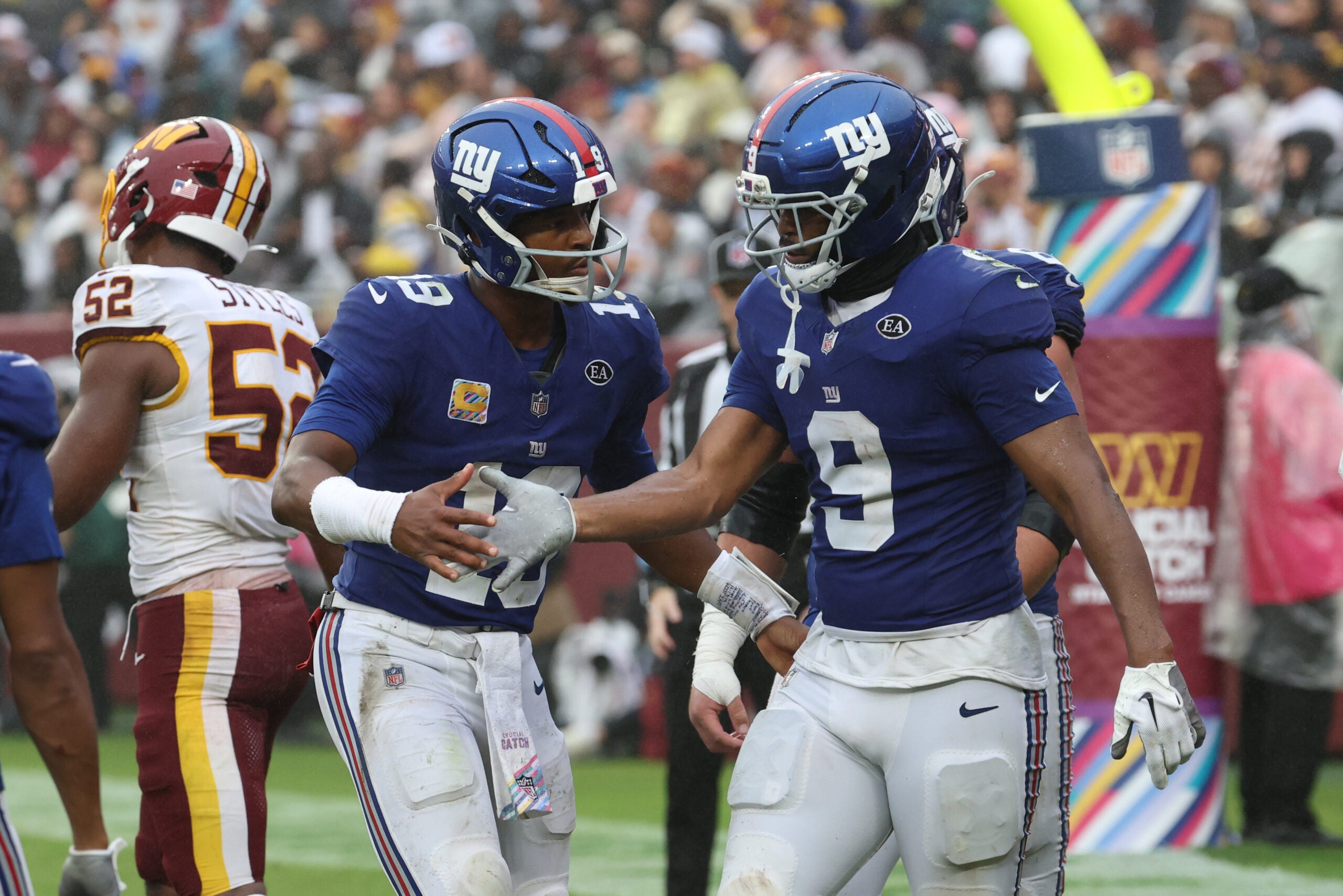 Oct 11, 2026; Landover, Maryland, USA; New York Giants quarterback Jameis Winston (19) and tight end Isaiah Likely (9) celebrate after connecting on a touchdown pass during the third quarter against the Washington Commanders at Northwest Stadium.
