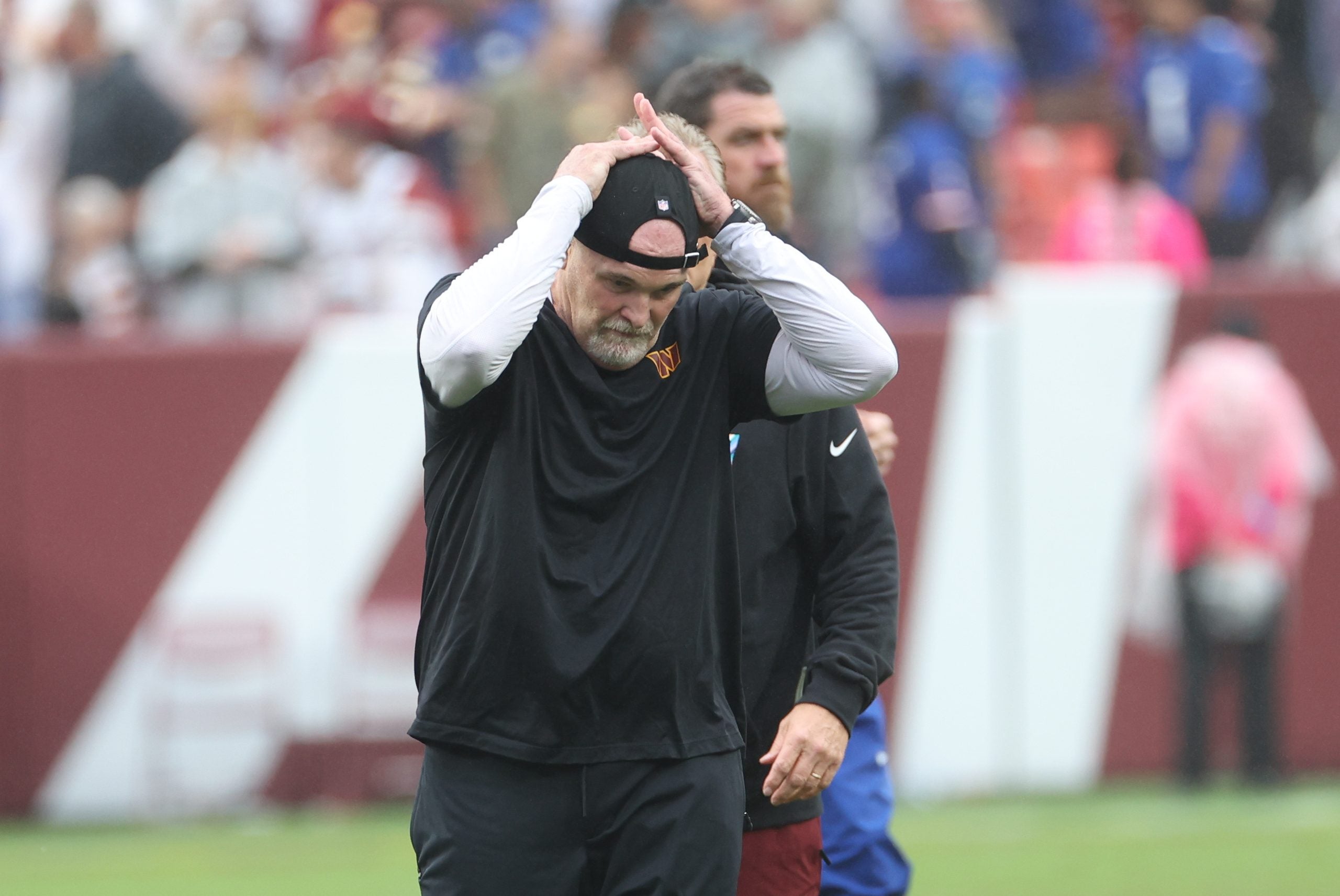 Oct 11, 2026; Landover, Maryland, USA; Washington Commanders head coach Dan Quinn reacts after the game against the New York Giants at Northwest Stadium.