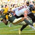 Oct 11, 2026; Green Bay, Wisconsin, USA; Green Bay Packers wide receiver Christian Watson (9) scores a touchdown against Chicago Bears safety Dillon Thieneman (31) during the game.