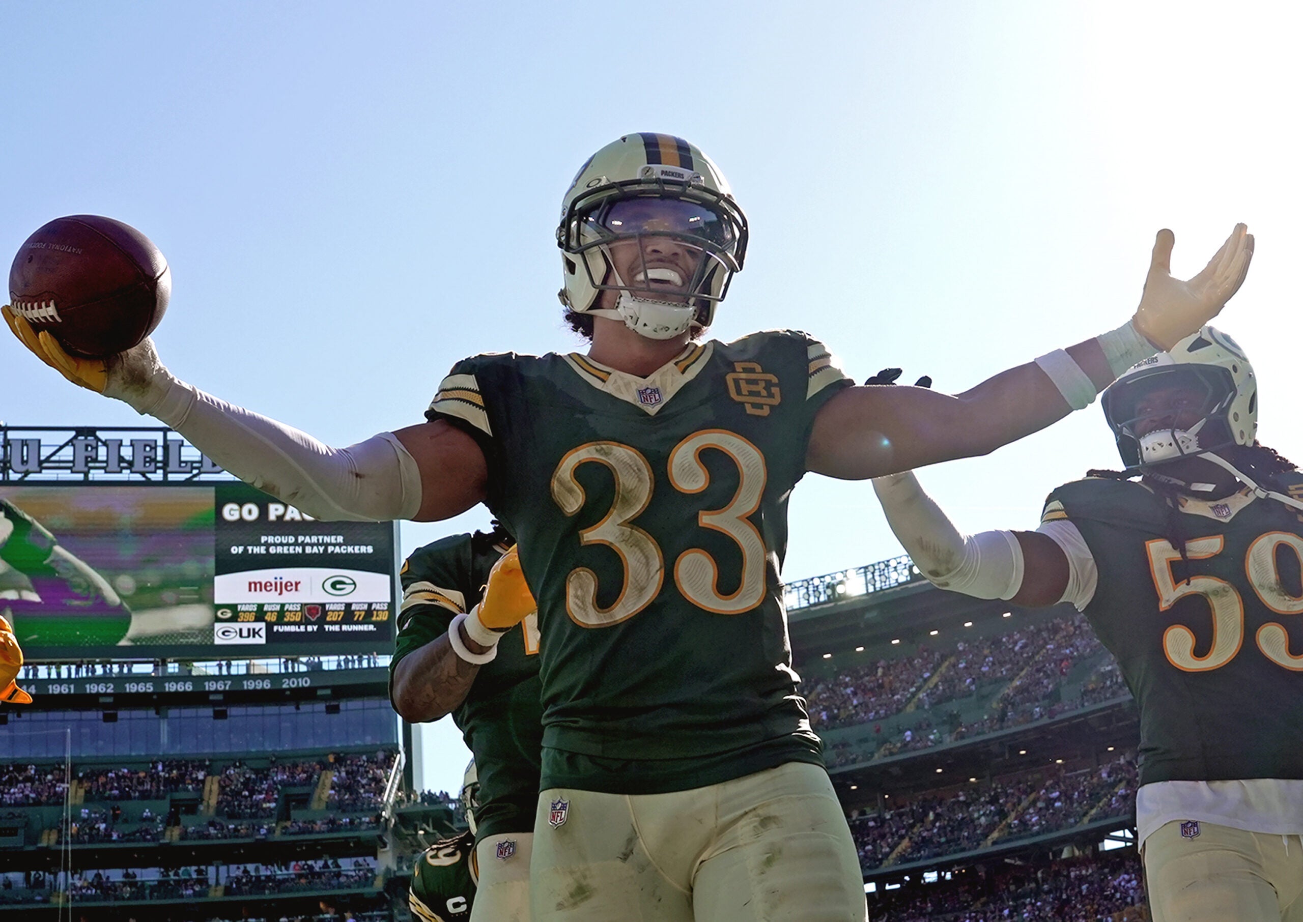 Oct 11, 2026; Green Bay, Wisconsin, USA; Green Bay Packers safety Evan Williams (33) celebrates a fumble recovery against the Chicago Bears during their football game at Lambeau Field.