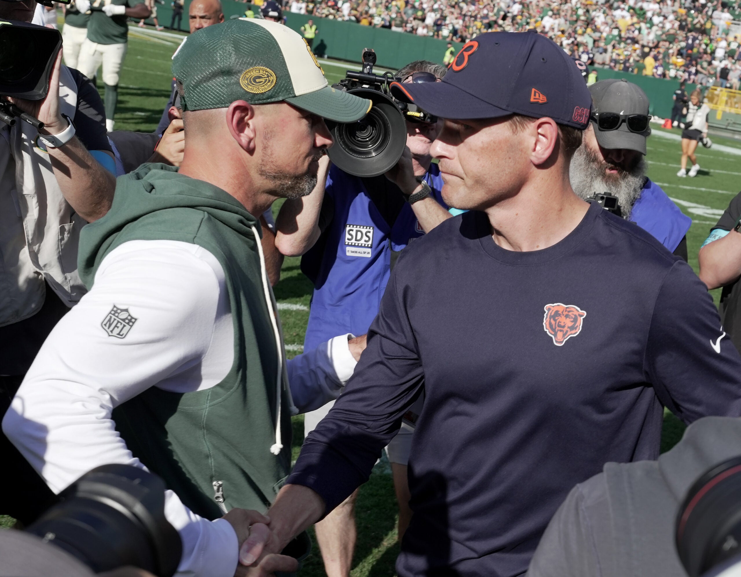 Oct 11, 2026; Green Bay, Wisconsin, USA; Green Bay Packers head coach Matt LaFleur and Chicago Bears head coach Ben Johnson shake hands following the game at Lambeau Field.