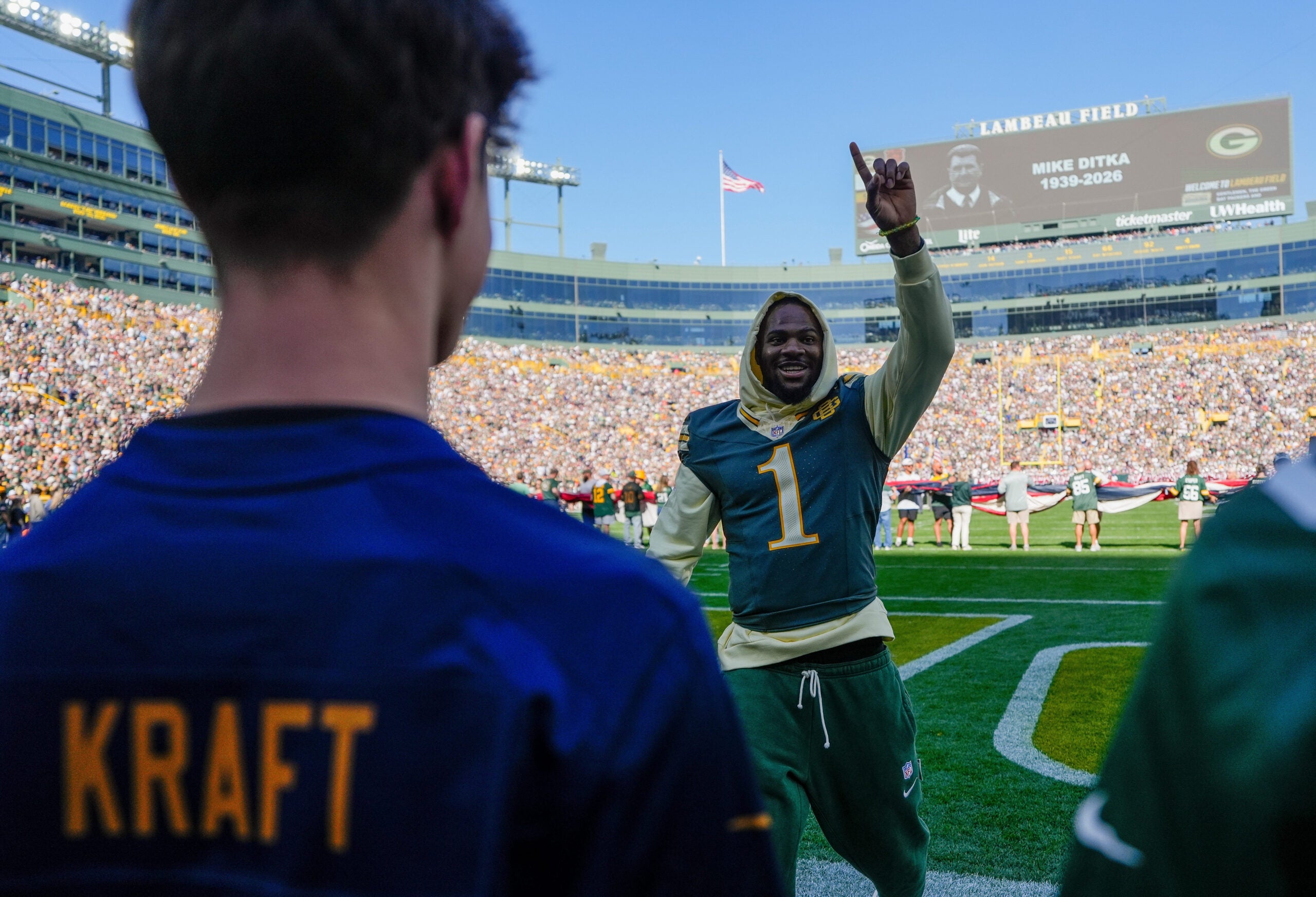 Green Bay Packers edge defender Micah Parsons (1) interacts with fans before a game against the Chicago Bears on Sunday, Oct. 11, 2026, at Lambeau Field in Green Bay, Wisconsin. The Packers won the game, 31-7.