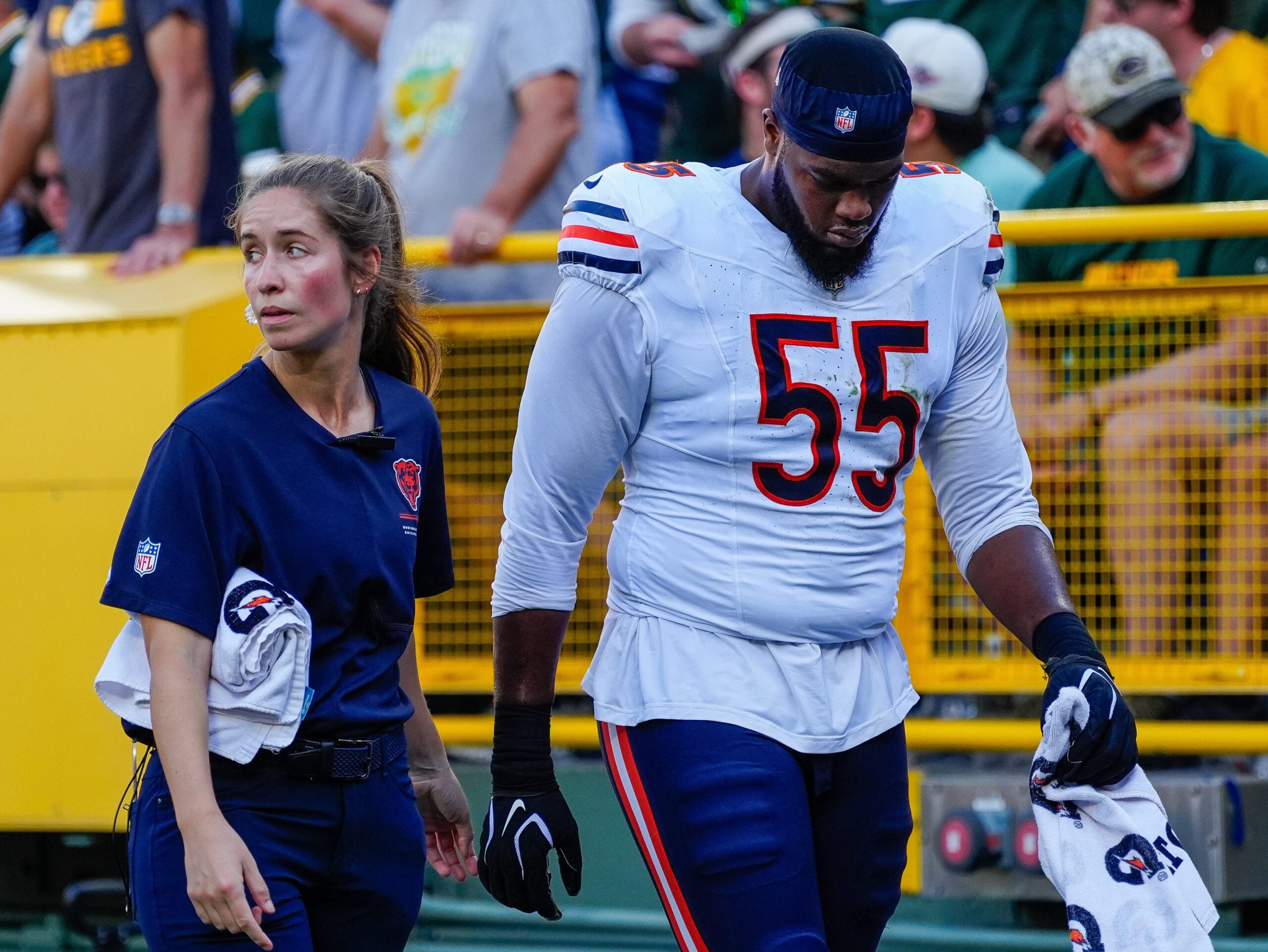 Chicago Bears defensive end Dayo Odeyingbo (55) walks to the locker room after being injured against the Green Bay Packers on Sunday, Oct. 11, 2026, at Lambeau Field in Green Bay, Wisconsin. The Packers won the game, 31-7.