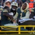 Green Bay Packers defensive end Micah Parsons (1) checks on defensive tackle Javon Hargrave (98) as Hargrave is carted off the field with an injury against the Chicago Bears on Sunday, Oct. 11, 2026, at Lambeau Field in Green Bay, Wisconsin. The Packers won the game, 31-7.