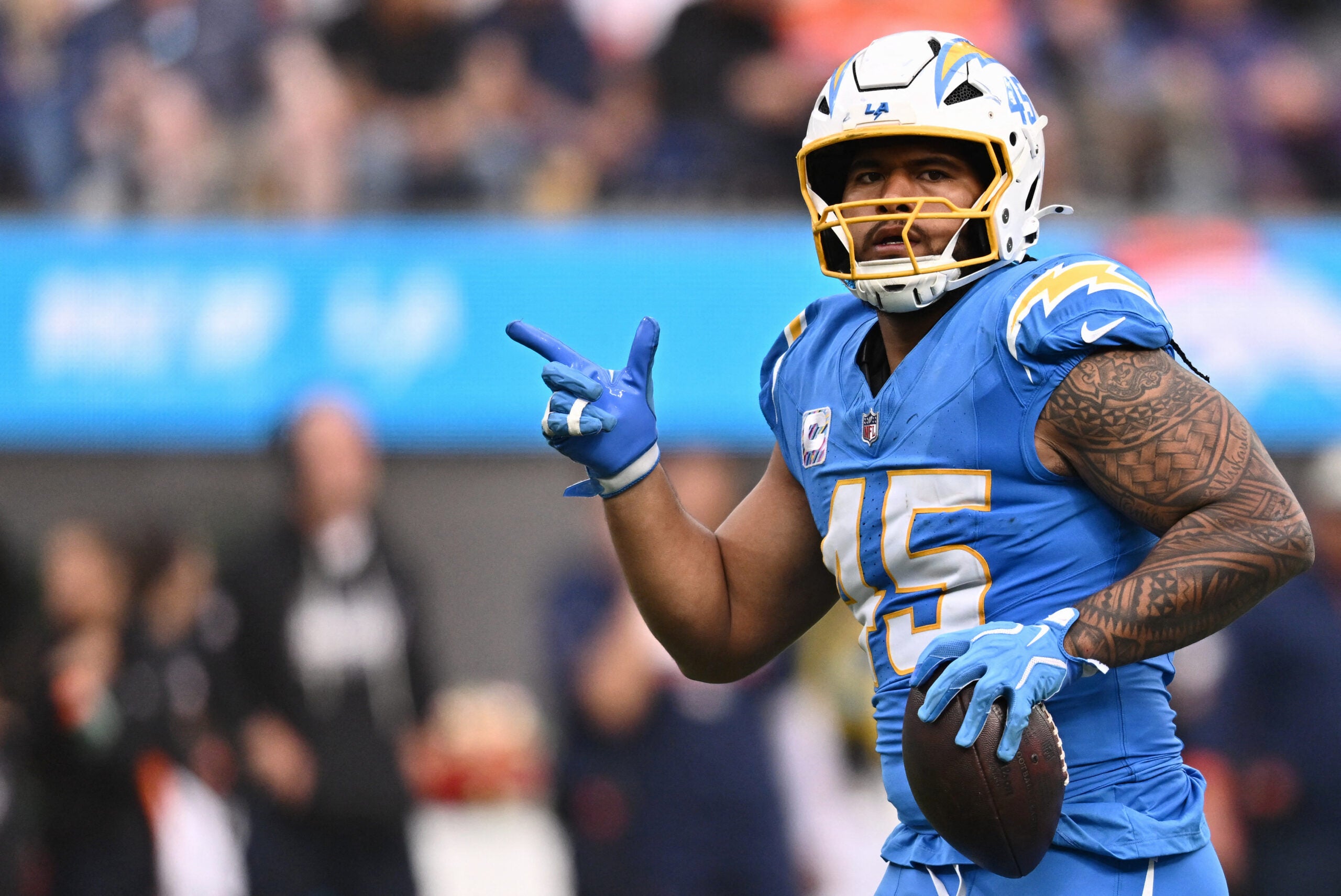 Oct 11, 2026; Inglewood, California, USA; Los Angeles Chargers linebacker Tuli Tuipulotu (45) celebrates after a fumble recovery against the Denver Broncos during the second half at SoFi Stadium.