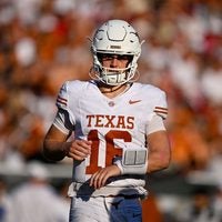 Oct 10, 2026; Dallas, Texas, USA; Texas Longhorns quarterback Arch Manning (16) runs back on the field during the game between the Sooners and the Longhorns at Cotton Bowl.