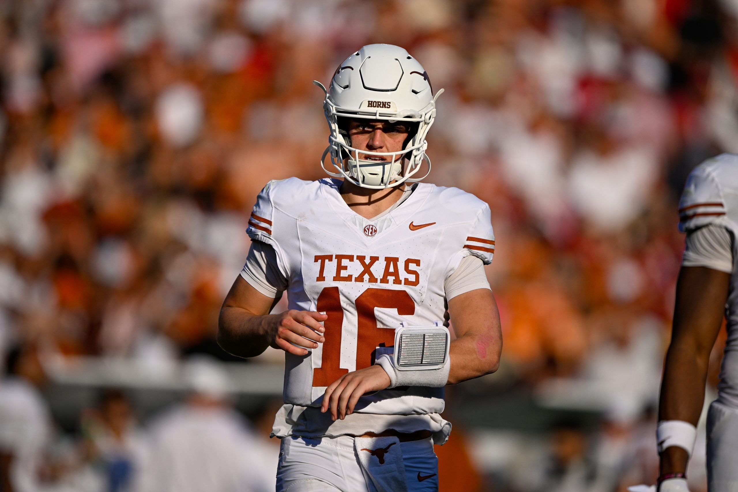 Oct 10, 2026; Dallas, Texas, USA; Texas Longhorns quarterback Arch Manning (16) runs back on the field during the game between the Sooners and the Longhorns at Cotton Bowl.