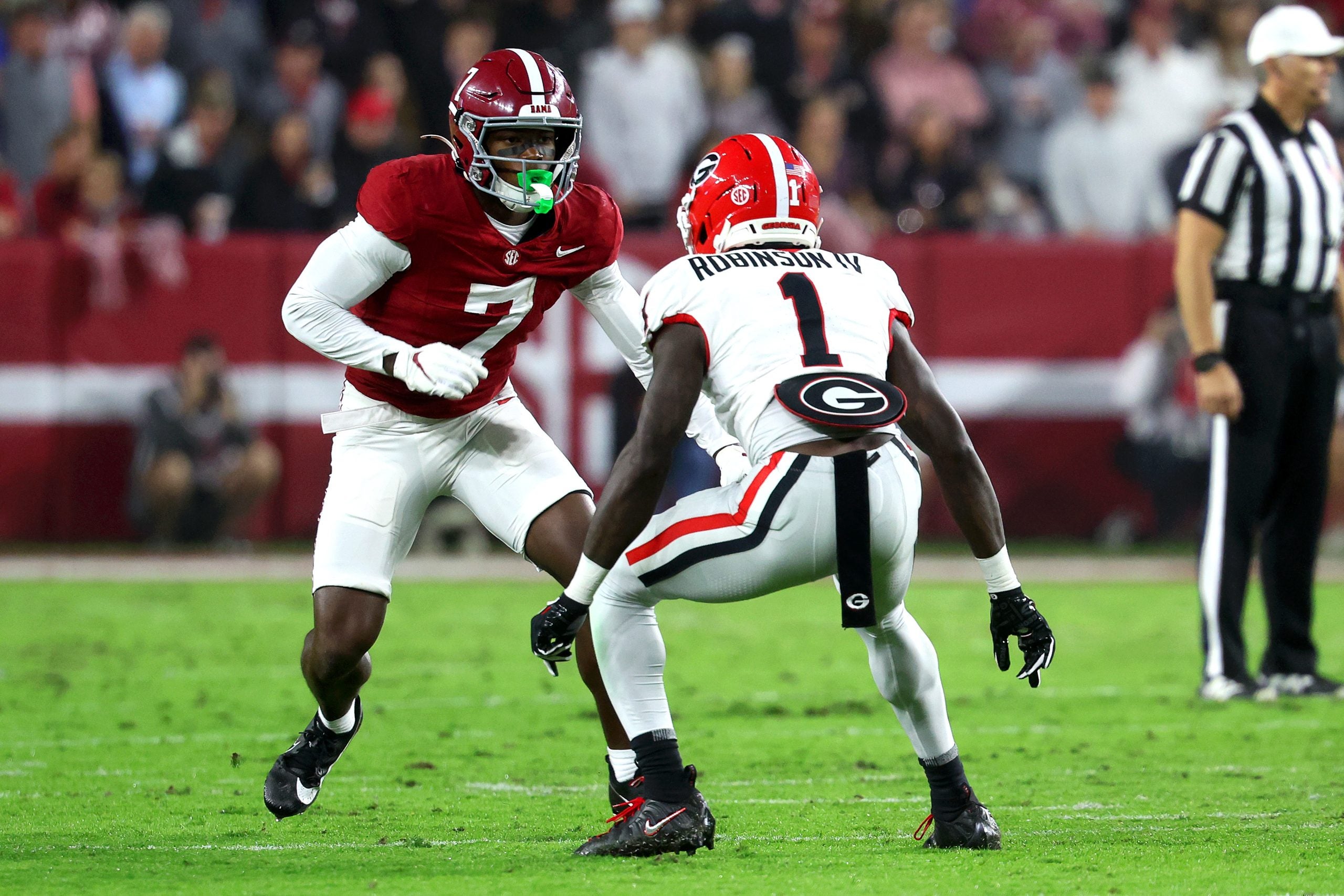 Oct 10, 2026; Tuscaloosa, Alabama, USA; Georgia Bulldogs defensive back Ellis Robinson IV (1) defends against Alabama Crimson Tide wide receiver Rico Scott (7) during the first quarter at Saban Field at Bryant-Denny Stadium.