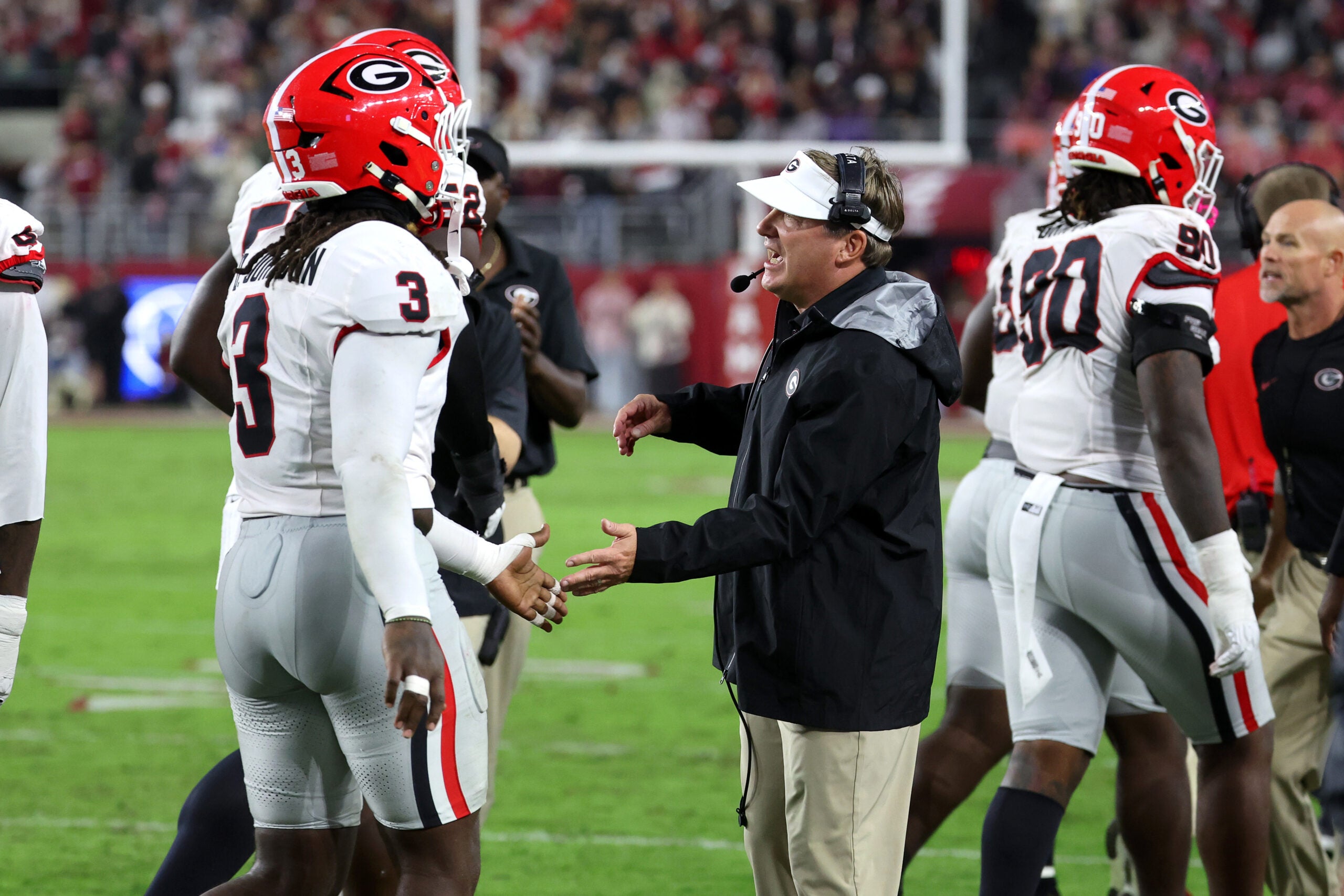 Oct 10, 2026; Tuscaloosa, Alabama, USA; Georgia Bulldogs head coach Kirby Smart high fives his players during the second quarter against the Alabama Crimson Tide at Saban Field at Bryant-Denny Stadium.