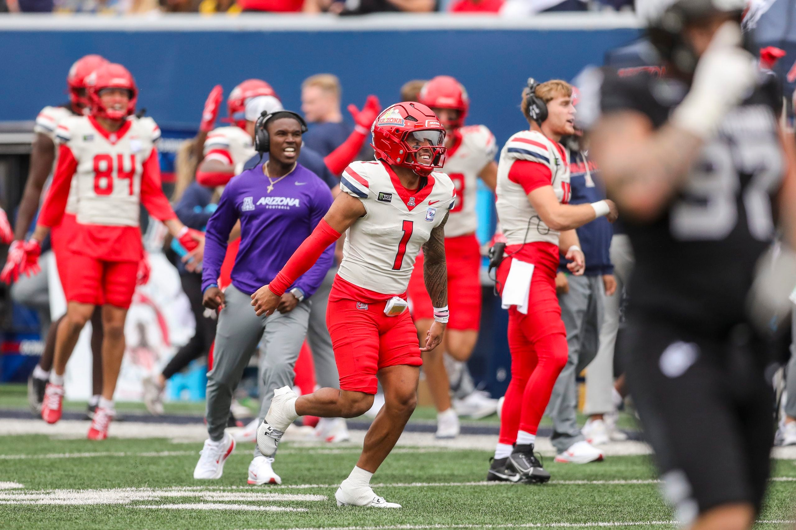 Oct 10, 2026; Morgantown, West Virginia, USA; Arizona Wildcats quarterback Noah Fifita (1) celebrates after a touchdown during the fourth quarter against the West Virginia Mountaineers at Milan Puskar Stadium.