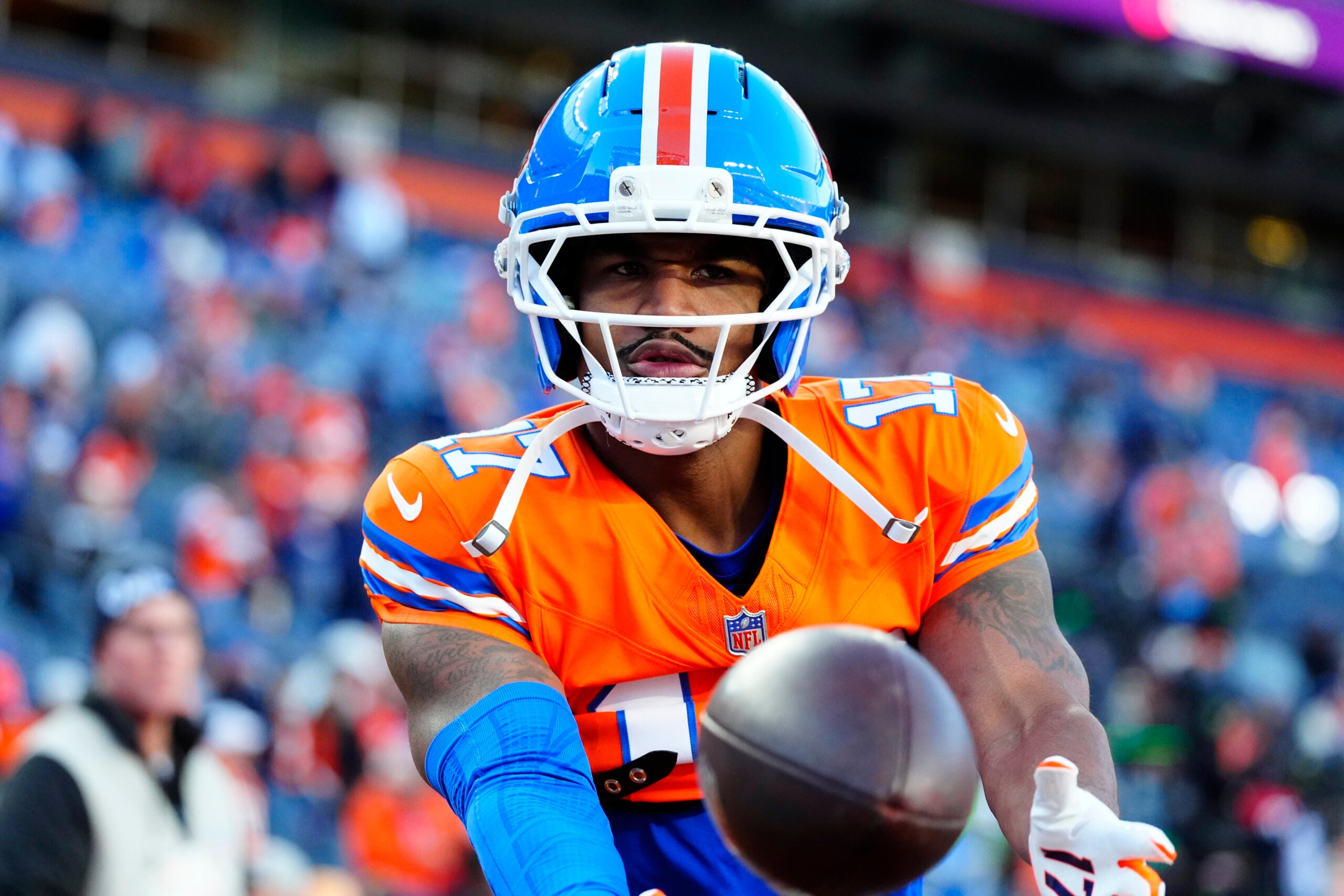 Oct 15, 2026; Denver, Colorado, USA; Denver Broncos wide receiver Jaylen Waddle (17) warms up before the game against the Seattle Seahawks at Empower Field at Mile High.