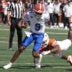 Oct 17, 2026; Austin, Texas, USA; Florida Gators quarterback Tramell Jones Jr. (9) escapes a tackle from Texas Longhorns linebacker Rasheem Biles (3) during the first half at Darrell K Royal-Texas Memorial Stadium.