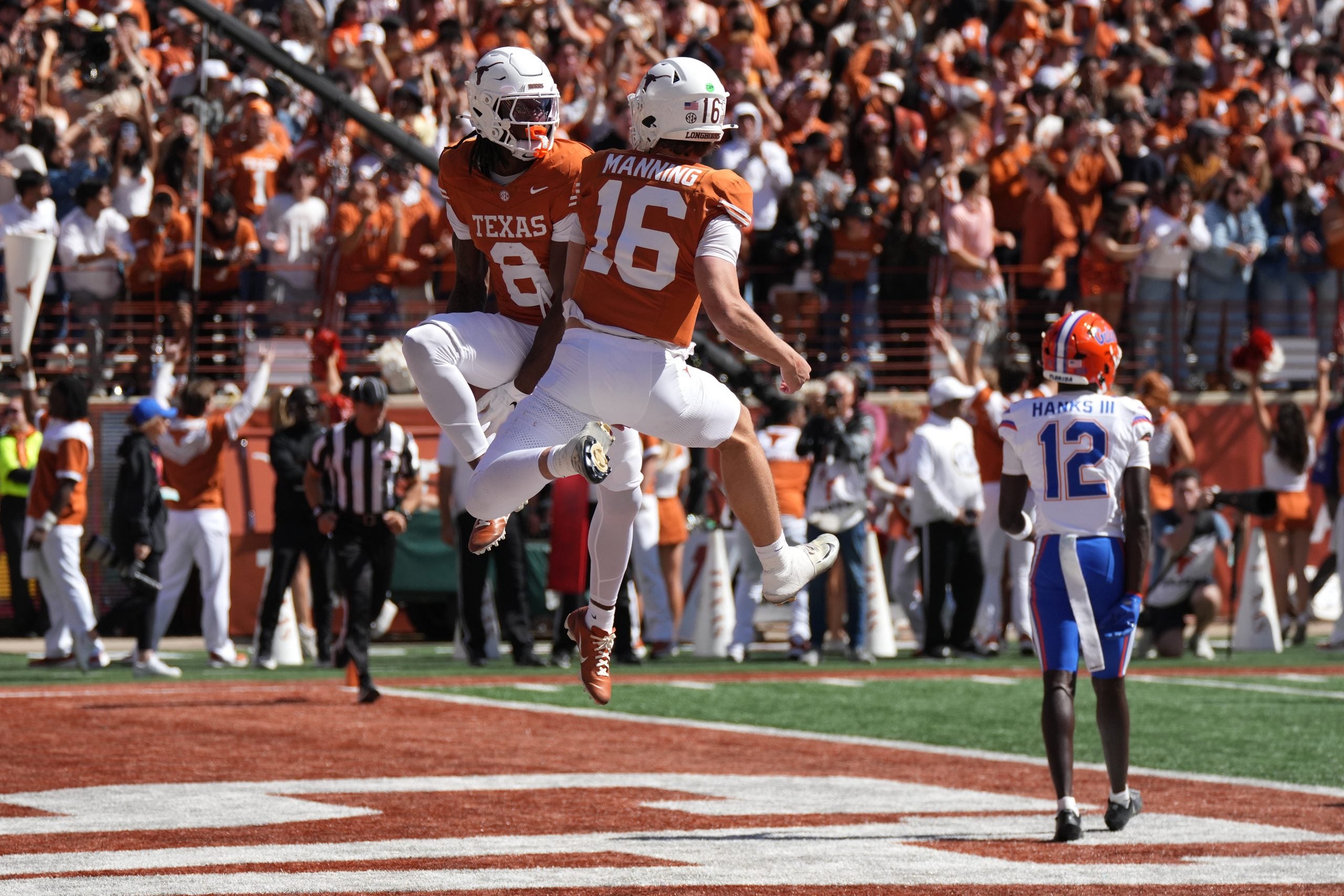 Oct 17, 2026; Austin, Texas, USA; Texas Longhorns wide receiver Cam Coleman (8) and quarterback Arch Manning (16) react after Coleman caught a touchdown pass from Manning during the second half against the Florida Gators at Darrell K Royal-Texas Memorial Stadium.