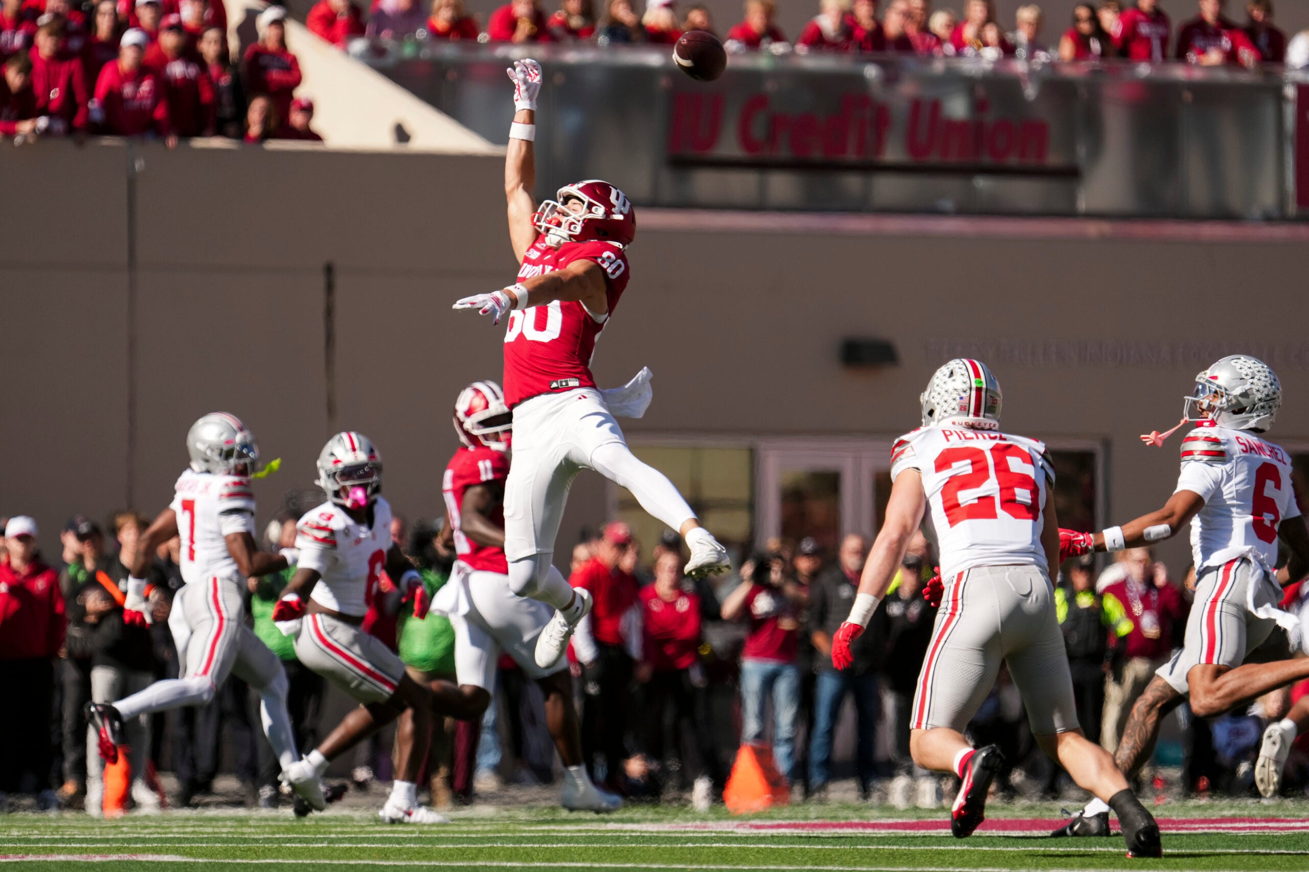 Indiana Hoosiers wide receiver Charlie Becker (80) reaches for a high pass from quarterback Josh Hoover (10) during the NCAA football game against the Ohio State Buckeyes at Memorial Stadium Stadium in Bloomington, Ind. on Oct. 17, 2026.