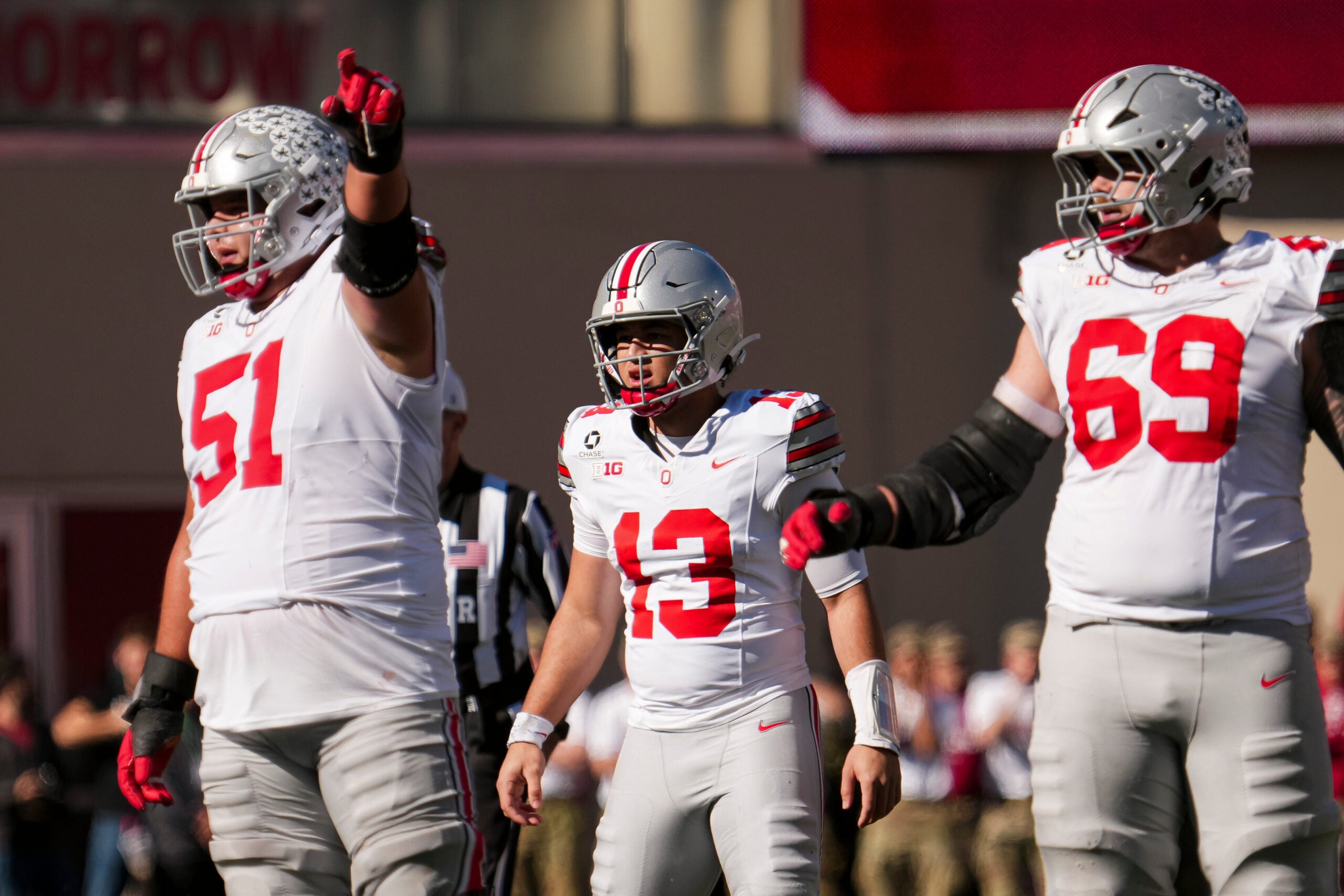 Ohio State Buckeyes quarterback Luke Fahey (13) lines up behind offensive lineman Luke Montgomery (51) and offensive lineman Ian Moore (69) during the NCAA football game against the Indiana Hoosiers at Memorial Stadium Stadium in Bloomington, Ind. on Oct. 17, 2026.