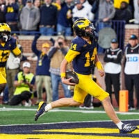 Michigan quarterback Tommy Carr runs into the end zone for a touchdown against Penn State late in the fourth quarter at Michigan Stadium in Ann Arbor on Saturday, Oct. 17, 2026.