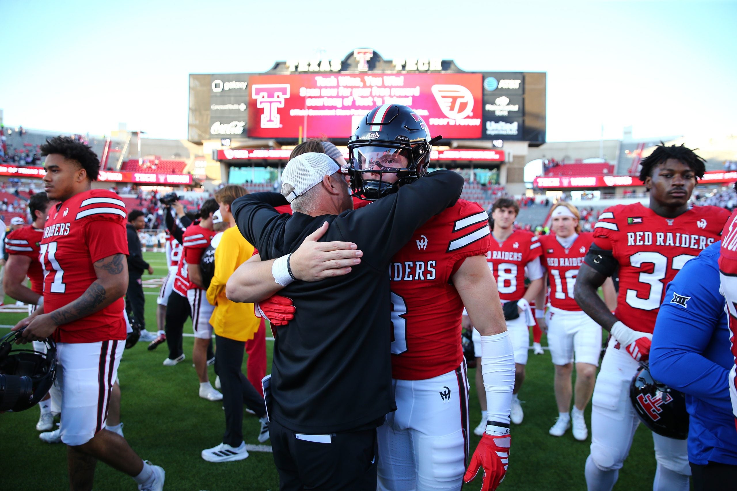 Oct 17, 2026; Lubbock, Texas, USA; Texas Tech Red Raiders head coach Joey McGuire hugs wide receiver Coy Eakin (8) after the game against the Arizona State Sun Devils at Galaxy Stadium.