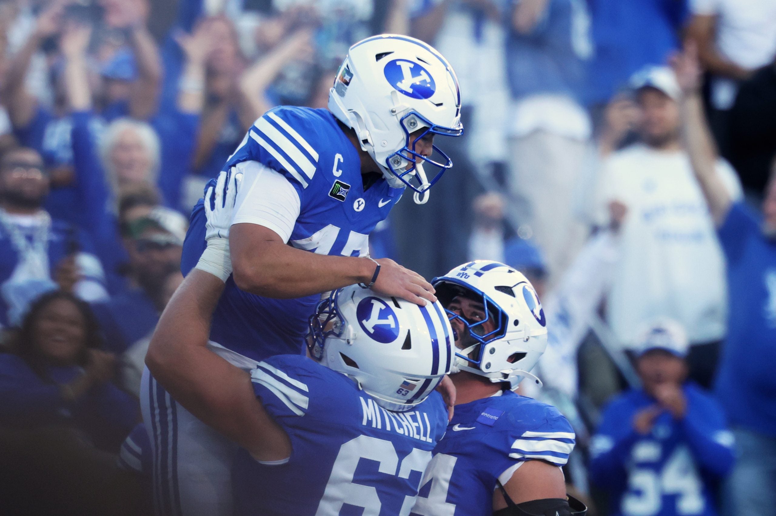 Oct 17, 2026; Provo, Utah, USA; Brigham Young Cougars quarterback Bear Bachmeier (47) celebrates with offensive line Bruce Mitchell (63) after scoring a touchdown against the Notre Dame Fighting Irish during the first halfat LaVell Edwards Stadium.
