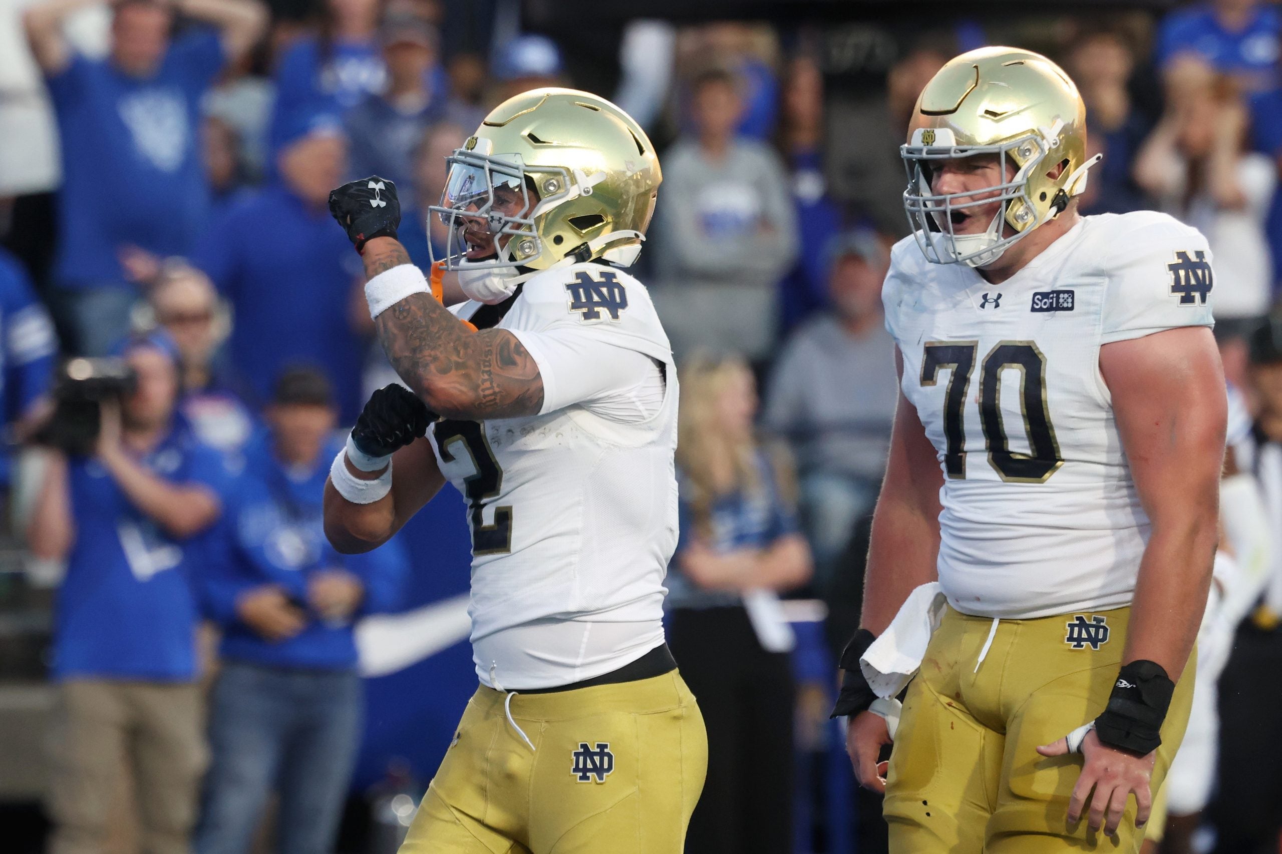 Oct 17, 2026; Provo, Utah, USA; Notre Dame Fighting Irish running back Nolan James Jr. (2) celebrates with offensive line Ashton Craig (70) after scoring a touchdown against the Brigham Young Cougars during the first half at LaVell Edwards Stadium.