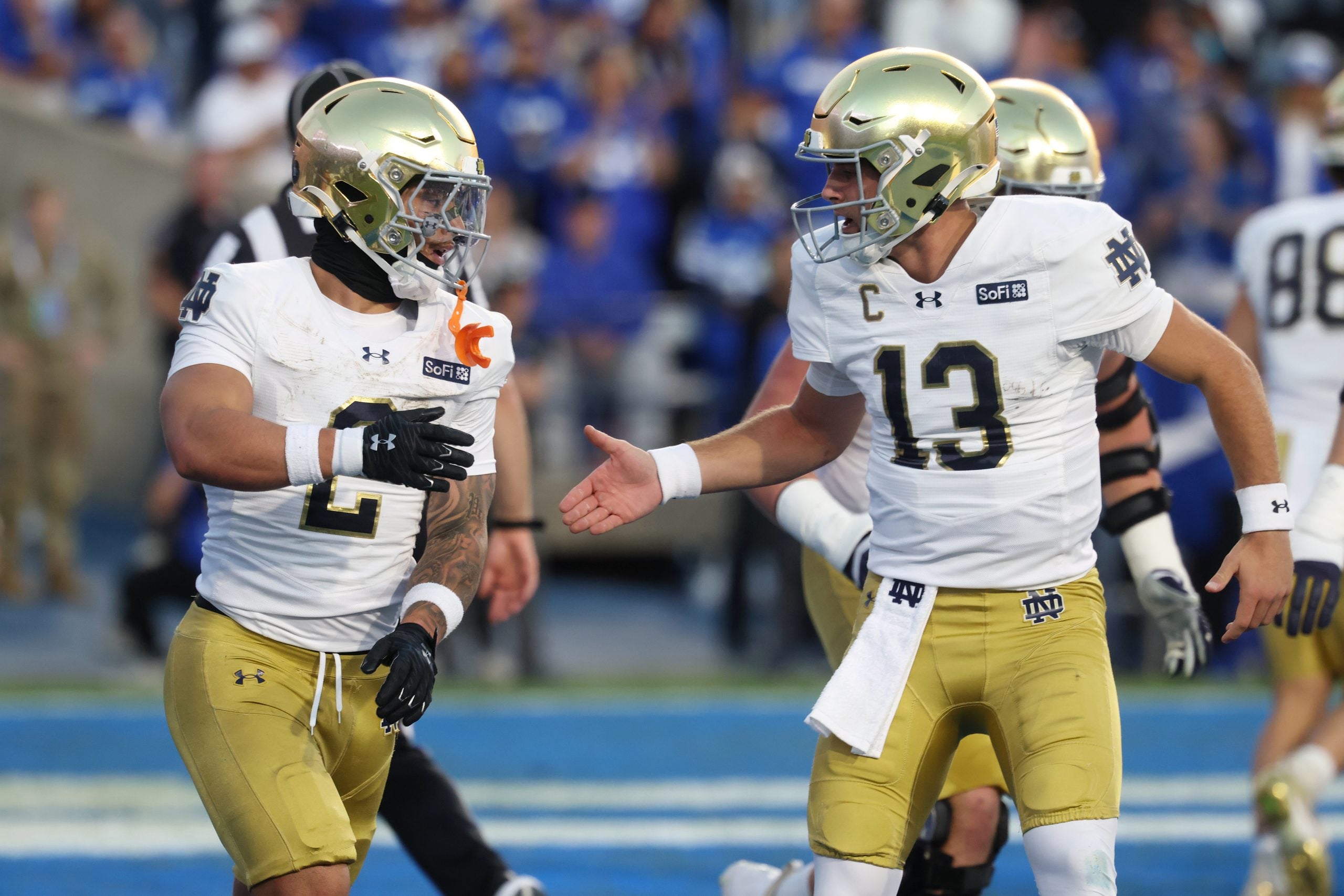 Oct 17, 2026; Provo, Utah, USA; Notre Dame Fighting Irish running back Nolan James Jr. (2) celebrates with quarterback CJ Carr (13) after scoring a touchdown against the Brigham Young Cougars during the first half at LaVell Edwards Stadium.