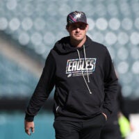 Oct 18, 2026; Philadelphia, Pennsylvania, USA; Philadelphia Eagles offensive coordinator Sean Mannion walks the field before a game against the Carolina Panthers at Lincoln Financial Field.