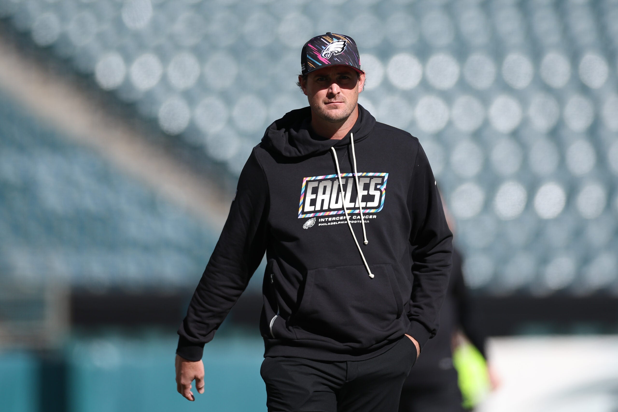 Oct 18, 2026; Philadelphia, Pennsylvania, USA; Philadelphia Eagles offensive coordinator Sean Mannion walks the field before a game against the Carolina Panthers at Lincoln Financial Field.