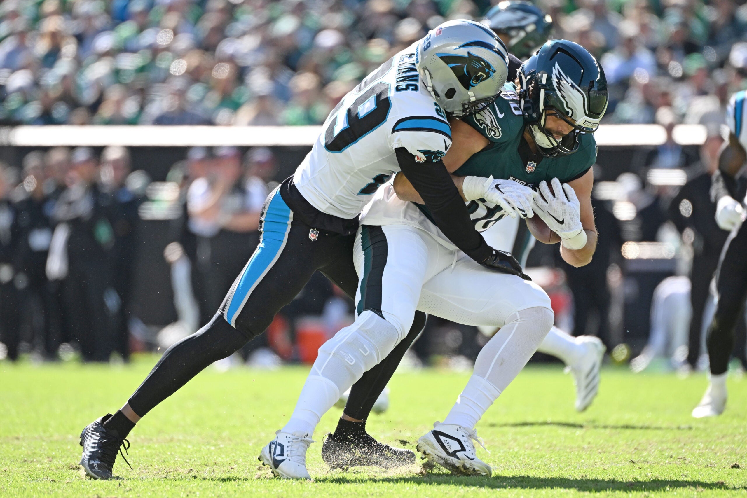 Oct 18, 2026; Philadelphia, Pennsylvania, USA; Philadelphia Eagles tight end Dallas Goedert (88) is tackled by Carolina Panthers cornerback Akayleb Evans (29) during the first half at Lincoln Financial Field.