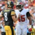 Oct 18, 2026; Tampa, Florida, USA; Pittsburgh Steelers quarterback Aaron Rodgers (8) speaks with Tampa Bay Buccaneers linebacker Josiah Trotter (45) during the third quarter at Raymond James Stadium.