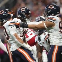 Oct 18, 2026; Atlanta, Georgia, USA; Chicago Bears running back Zavier Scott (30) and defensive line Daniel Hardy (92) celebrates during the third quarter against the Atlanta Falcons at Mercedes-Benz Stadium.