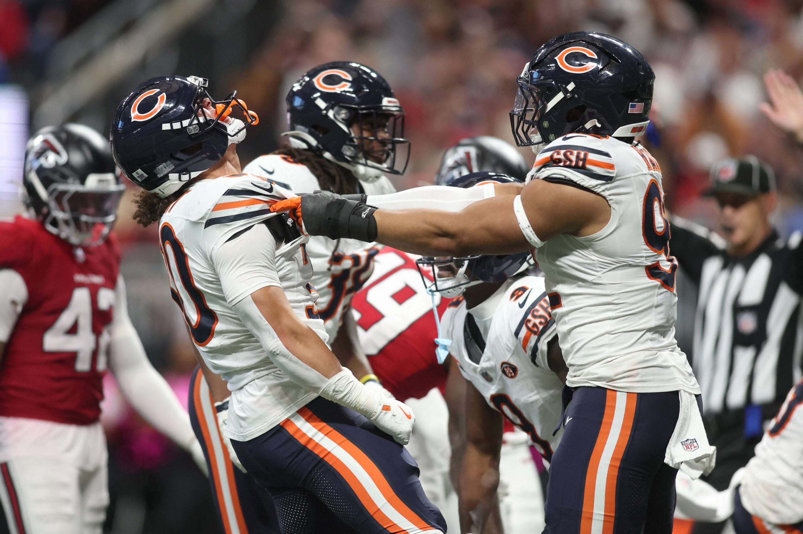 Oct 18, 2026; Atlanta, Georgia, USA; Chicago Bears running back Zavier Scott (30) and defensive line Daniel Hardy (92) celebrates during the third quarter against the Atlanta Falcons at Mercedes-Benz Stadium.