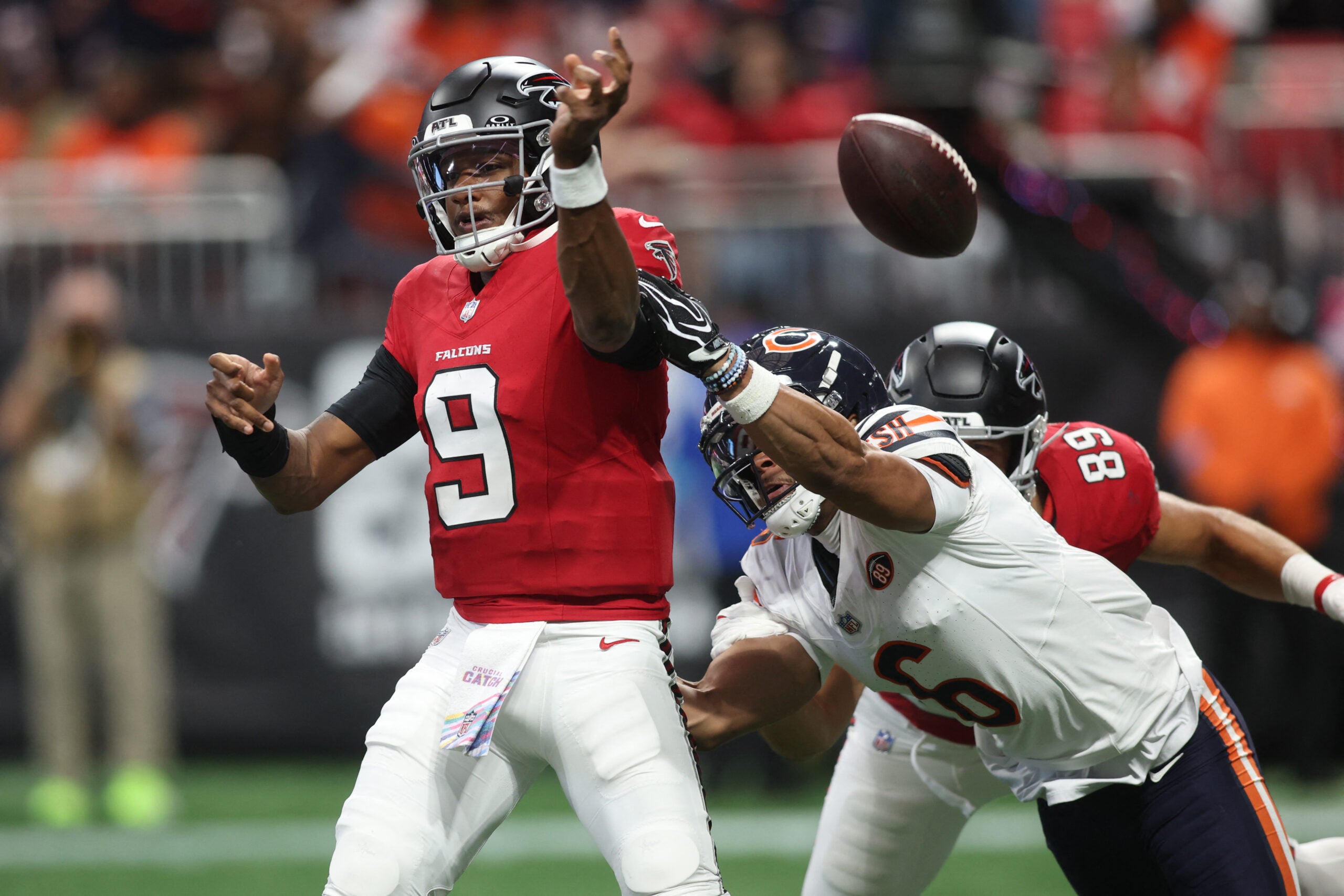 Oct 18, 2026; Atlanta, Georgia, USA; Chicago Bears defensive back Kyler Gordon (6) strips the ball from Atlanta Falcons quarterback Michael Penix Jr. (9) during the third quarter at Mercedes-Benz Stadium.