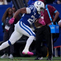 Indianapolis Colts running back Jonathan Taylor (28) rushes down the sideline Sunday, Oct. 18, 2026, during the game against the Tennessee Titans at Lucas Oil Stadium in Indianapolis.