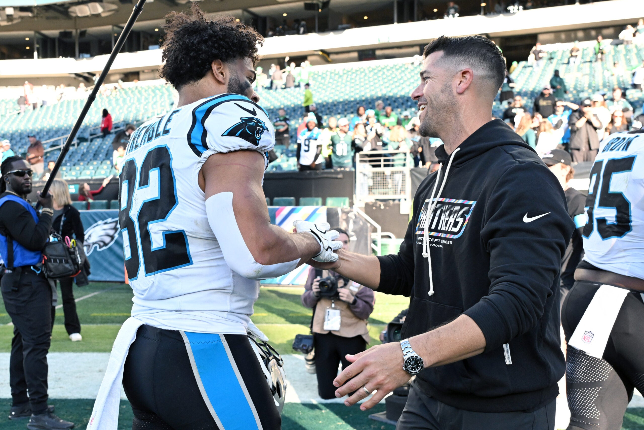 Oct 18, 2026; Philadelphia, Pennsylvania, USA; Carolina Panthers head coach Dave Canales greets tight end Tommy Tremble (82) after win against the Philadelphia Eagles at Lincoln Financial Field.