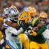 Oct 18, 2026; Green Bay, Wisconsin, USA; Green Bay Packers running back MarShawn Lloyd (32) runs the ball against Dallas Cowboys cornerback DaRon Bland (26) during the during the first quarter at Lambeau Field.
