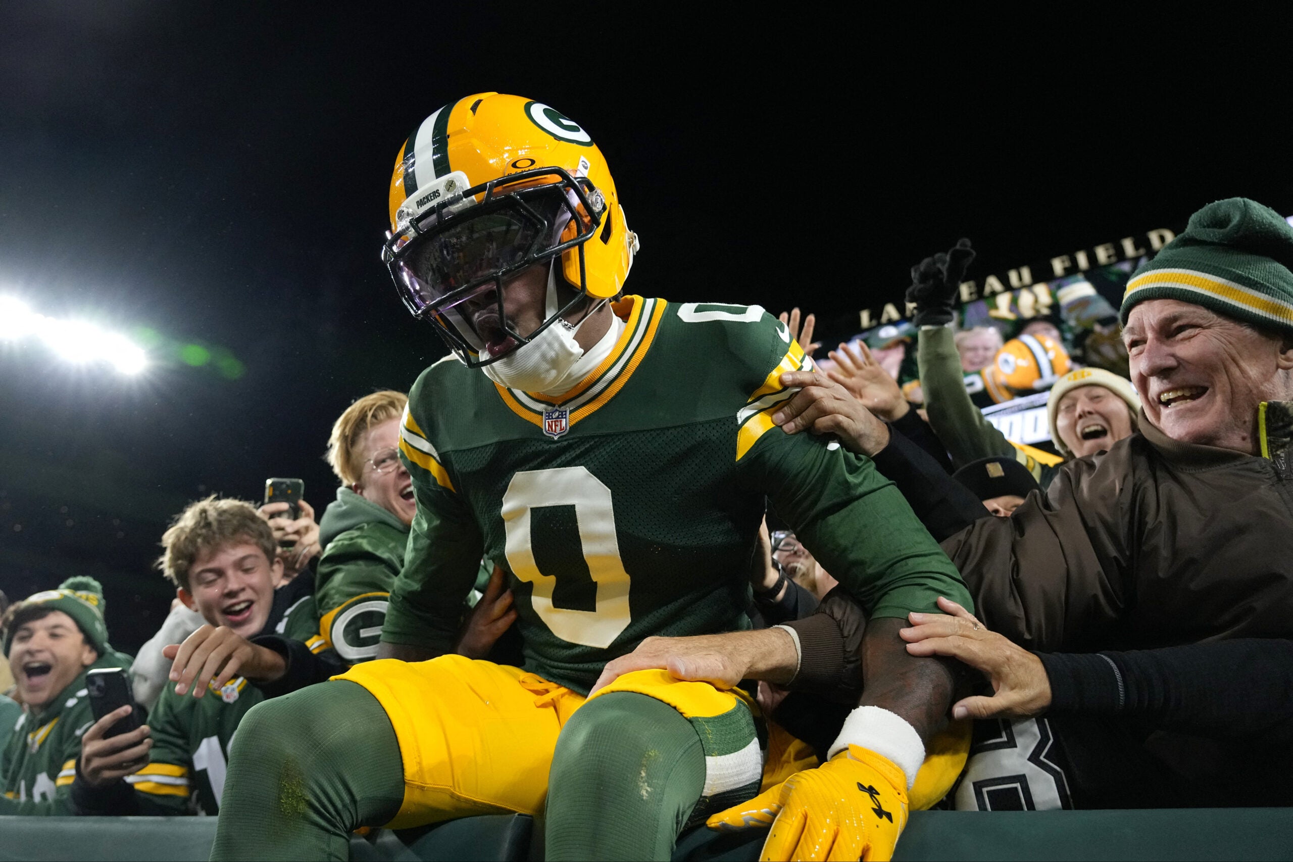 Oct 18, 2026; Green Bay, Wisconsin, USA; Green Bay Packers wide receiver Matthew Golden (0) celebrates with fans after scoring a touchdown against the Dallas Cowboys during the first quarter at Lambeau Field.
