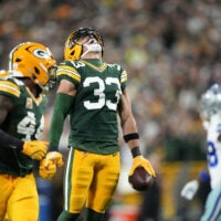 Oct 18, 2026; Green Bay, Wisconsin, USA; Green Bay Packers safety Evan Williams (33) celebrates after making an interception against the Dallas Cowboys during the second quarter at Lambeau Field.