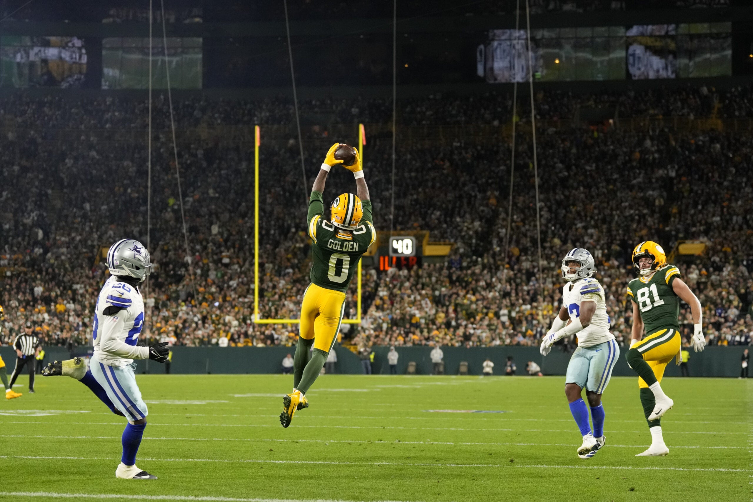 Oct 18, 2026; Green Bay, Wisconsin, USA; Green Bay Packers wide receiver Matthew Golden (0) makes a catch against the Dallas Cowboys during the second quarter at Lambeau Field.