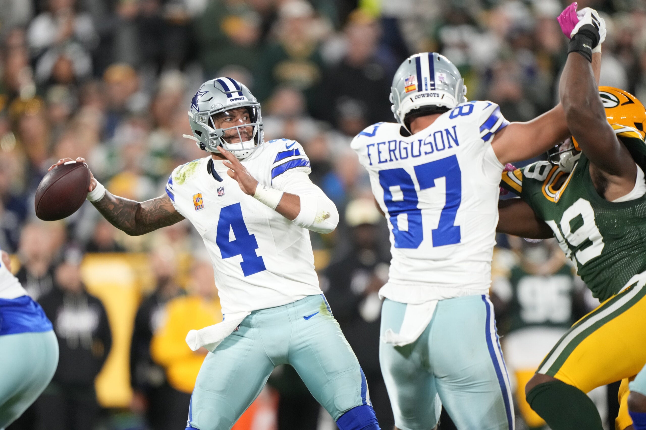 Oct 18, 2026; Green Bay, Wisconsin, USA; Dallas Cowboys quarterback Dak Prescott (4) passes against the Green Bay Packers during the second half at Lambeau Field.