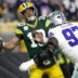 Dallas Cowboys defensive tackle Kenny Clark (97) sacks Green Bay Packers quarterback Jordan Love (10) during the third quarter of their game Sunday, Oct. 18, 2026 at Lambeau Field in Green Bay, Wisconsin.