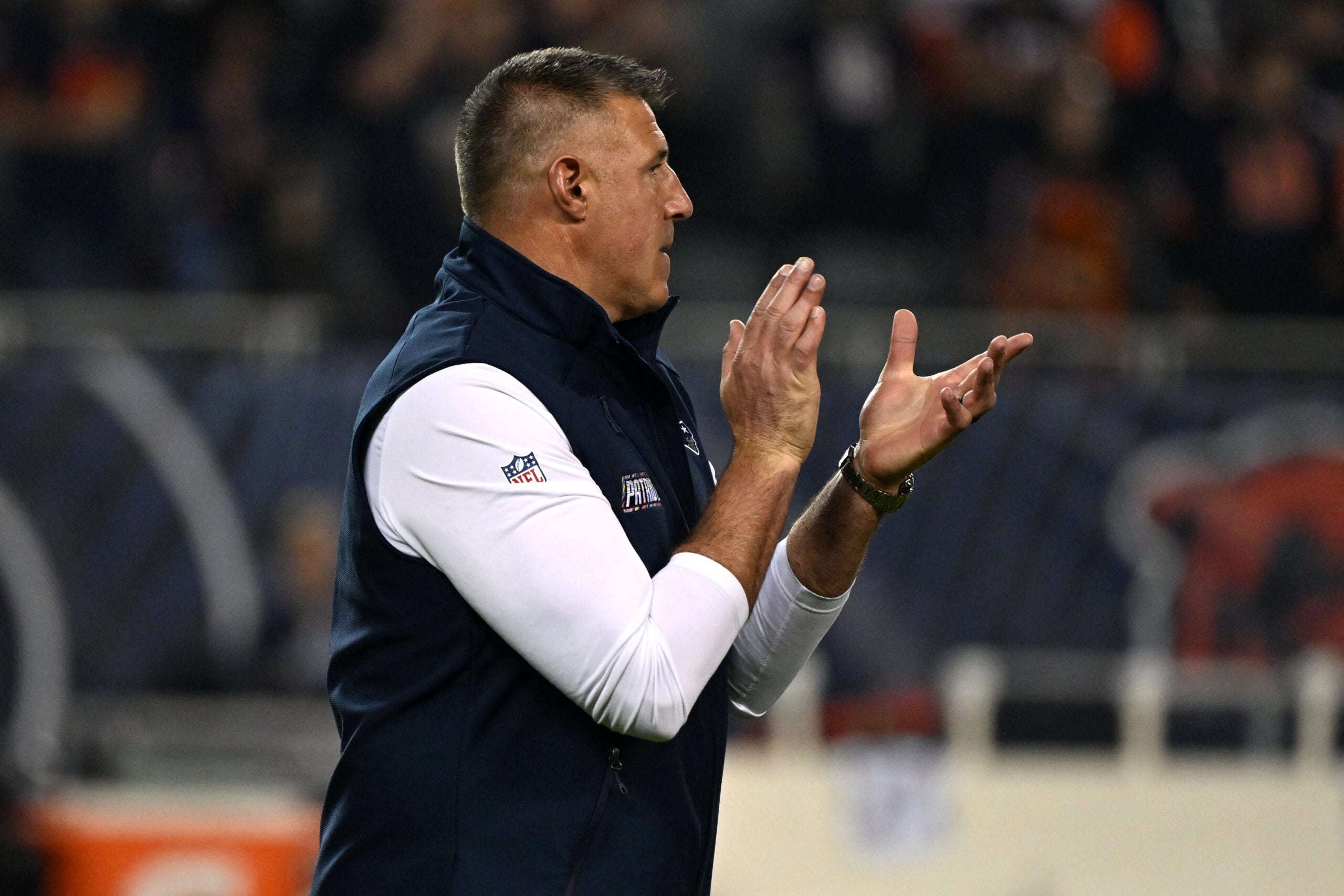 Oct 22, 2026; Chicago, Illinois, USA; New England Patriots head coach Mike Vrabel looks on during warm ups prior to the game against the Chicago Bears Soldier Field.