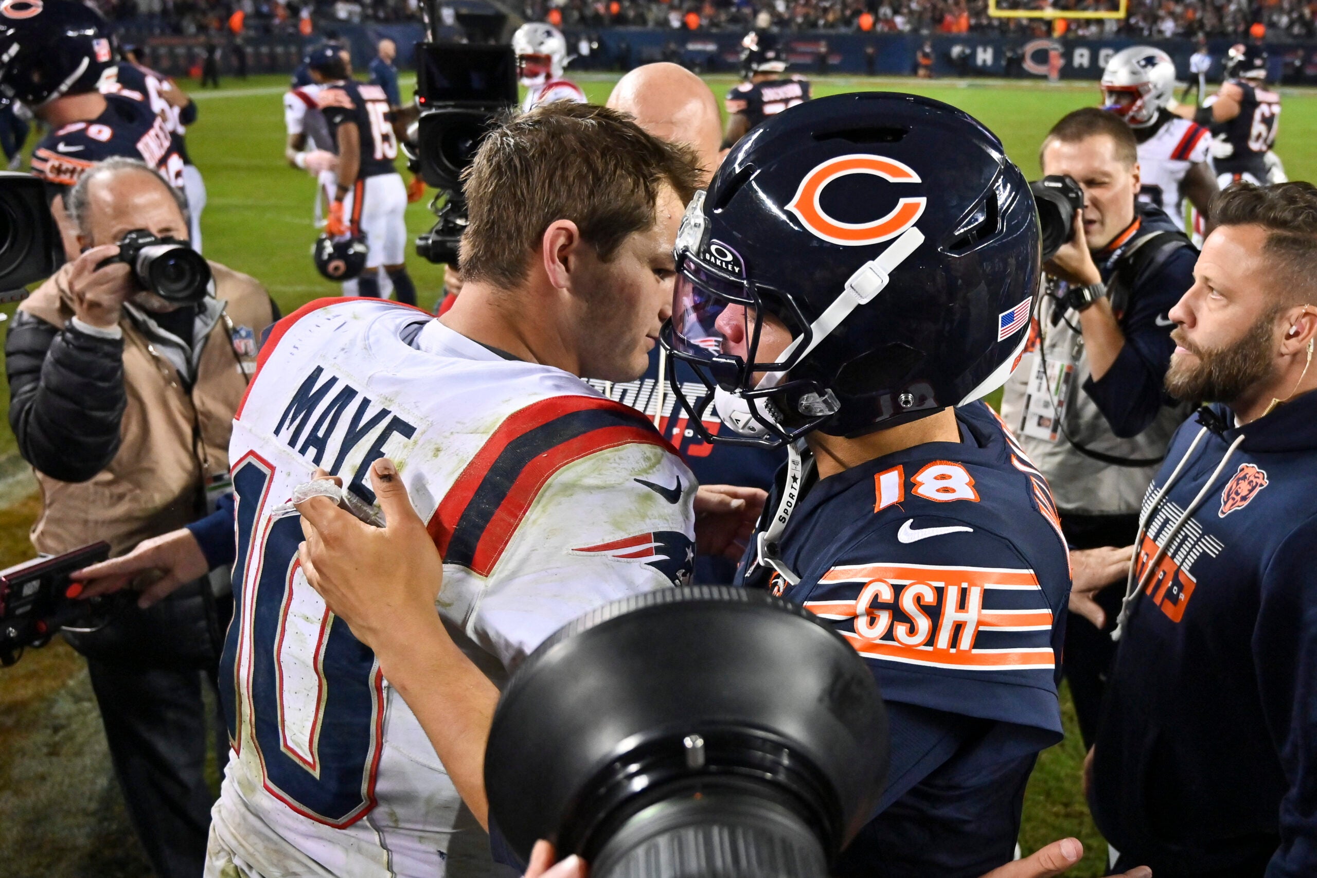 Oct 22, 2026; Chicago, Illinois, USA; New England Patriots quarterback Drake Maye (10) and Chicago Bears quarterback Caleb Williams (18) hug after the game at Soldier Field.