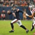 Oct 22, 2026; Chicago, Illinois, USA; Chicago Bears quarterback Caleb Williams (18) scrambles against New England Patriots linebacker Christian Elliss (53) during the fourth quarter at Soldier Field.