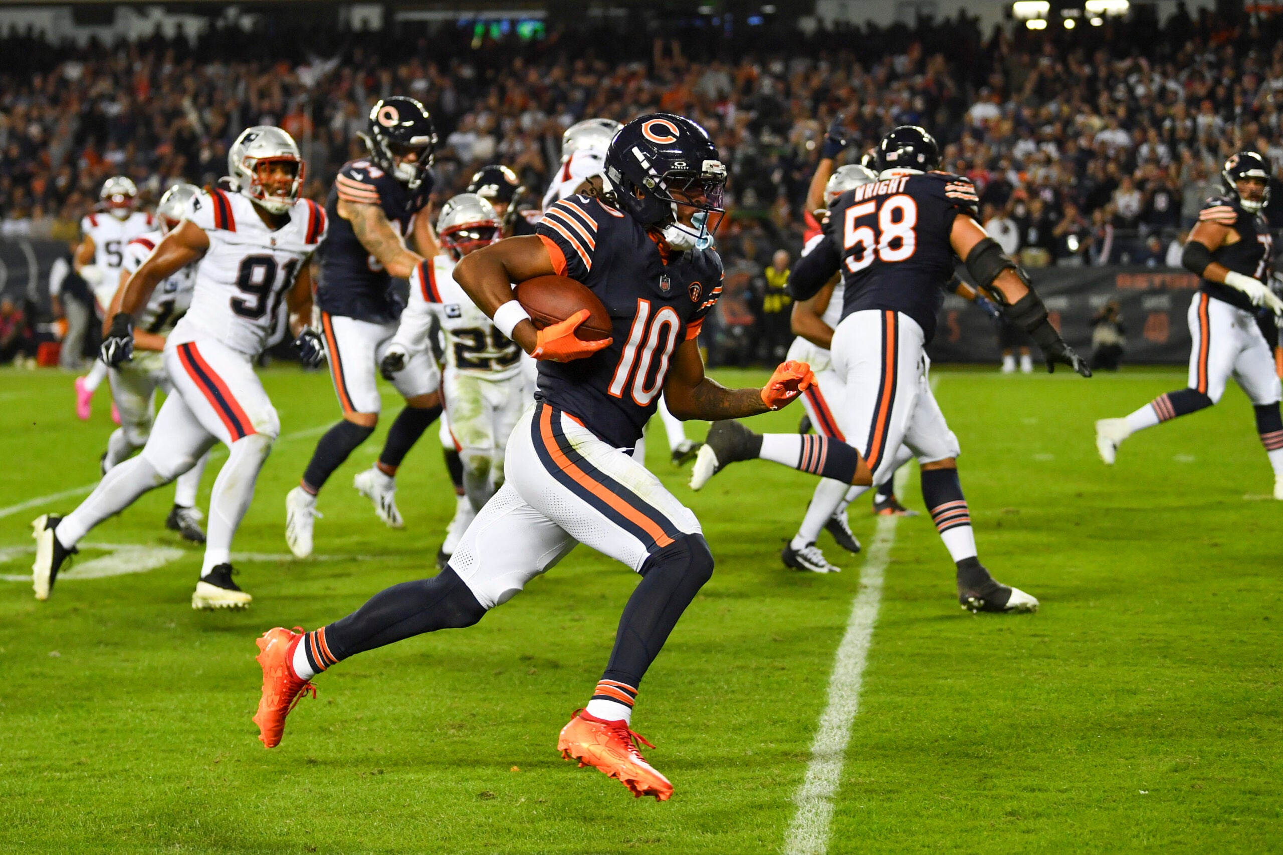Oct 22, 2026; Chicago, Illinois, USA; Chicago Bears wide receiver Luther Burden III (10) runs for a touchdown against the New England Patriots at Soldier Field.