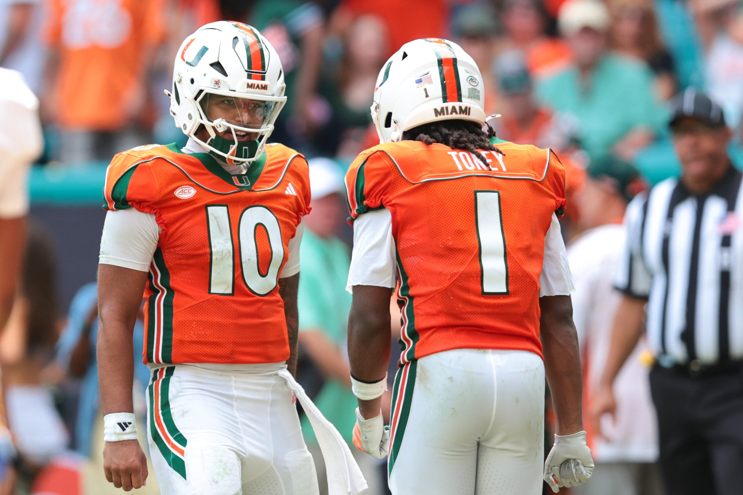 Oct 24, 2026; Miami Gardens, Florida, USA; Miami Hurricanes wide receiver Malachi Toney (1) celebrates with quarterback Darian Mensah (10) after scoring a touchdown against the Pittsburgh Panthers during the second quarter at Hard Rock Stadium.