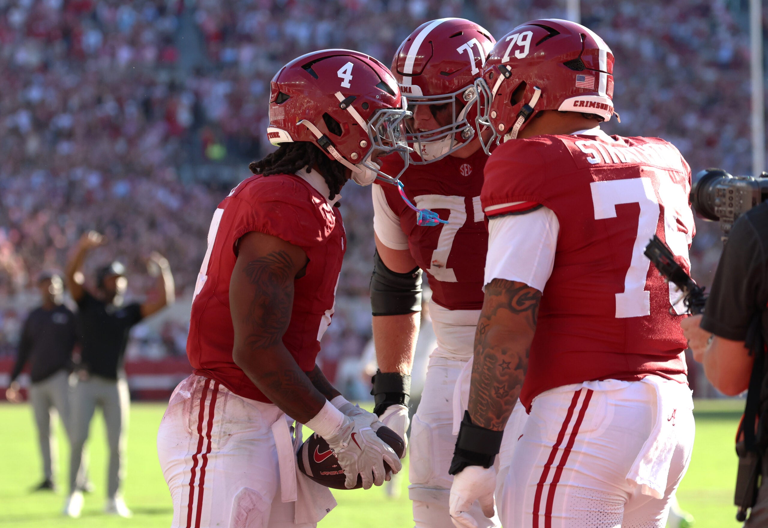 Oct 24, 2026; Tuscaloosa, Alabama, USA; Alabama Crimson Tide running back Daniel Hill (4) celebrates with Alabama Crimson Tide offensive lineman Jackson Lloyd (77) and Alabama Crimson Tide offensive lineman Kaden Strayhorn (79) after scoring a touchdown against the Texas A&M Aggies during the first half at Saban Field at Bryant-Denny Stadium.