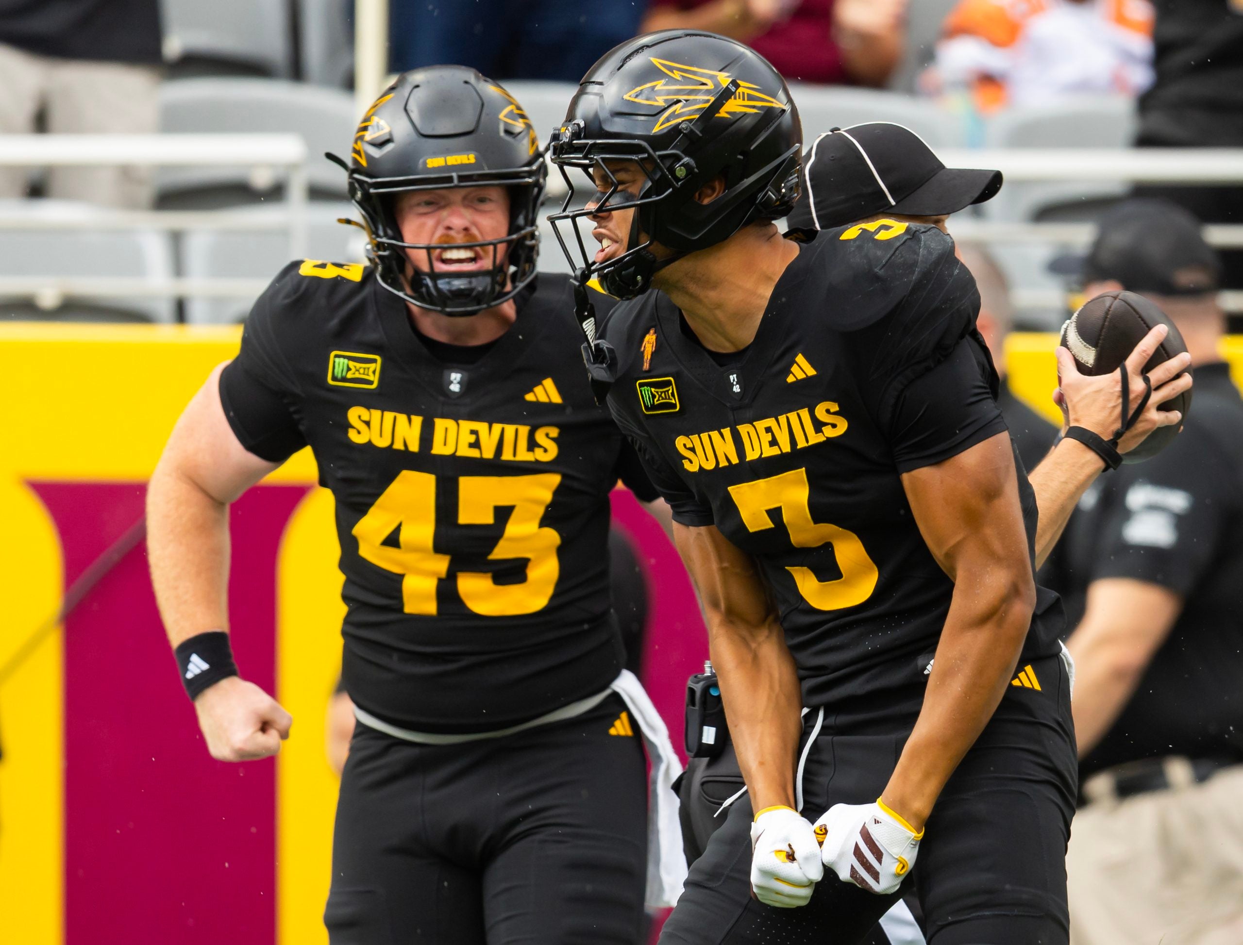 Oct 24, 2026; Tempe, Arizona, USA; Arizona State Sun Devils wide receiver Reed Harris (3) celebrates with Grayson Curtis (43) after catching a pass against the Kansas State Wildcats in the first half at Mountain America Stadium.