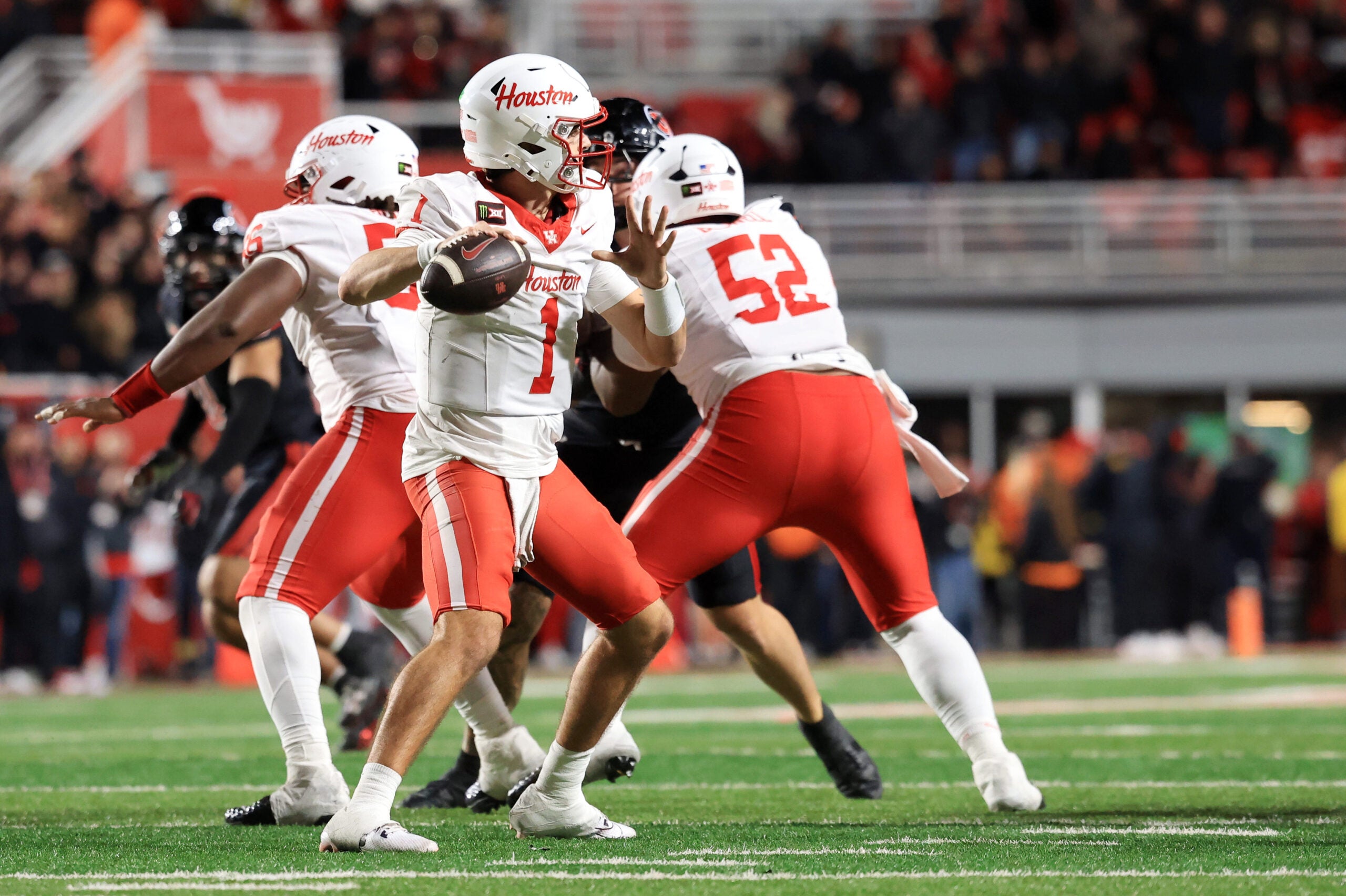 Oct 24, 2026; Salt Lake City, Utah, USA; Houston Cougars quarterback Conner Weigman (1) throws a pass during the fourth quarter against the Utah Utes at Rice-Eccles Stadium.