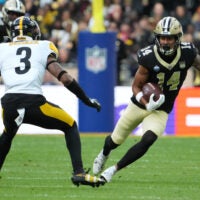 Oct 25, 2026; Paris, FRA; New Orleans Saints wide receiver Devaughn Vele (14) runs after the catch as Pittsburgh Steelers safety Jaquan Brisker (3) defends during the first quarter at Stade de France Stadium.
