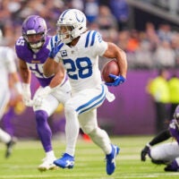 Oct 25, 2026; Minneapolis, Minnesota, USA; Indianapolis Colts running back Jonathan Taylor (28) rushes the ball against the Minnesota Vikings in the first half at U.S. Bank Stadium.