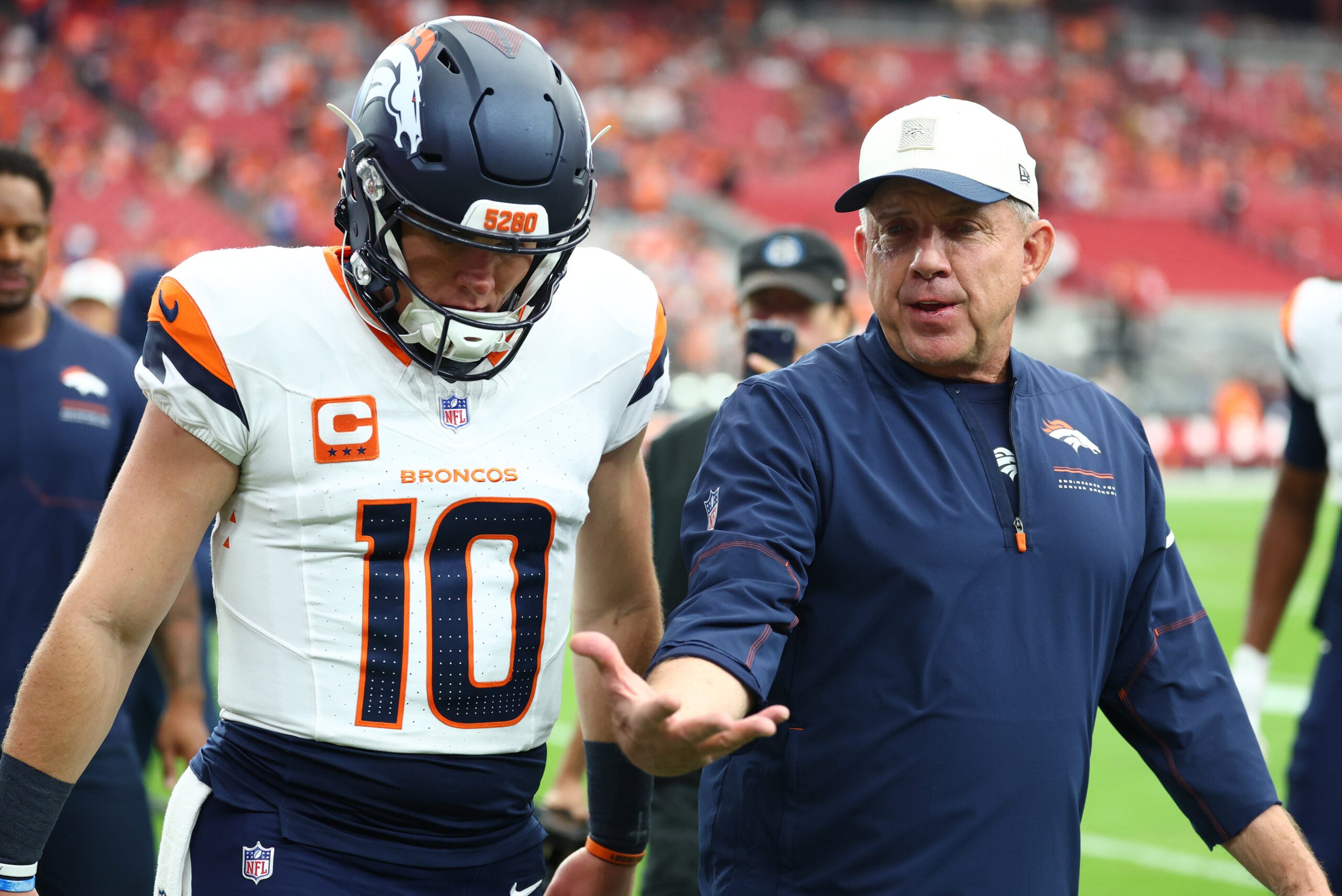 Oct 25, 2026; Glendale, Arizona, USA; Denver Broncos head coach Sean Payton talks with quarterback Bo Nix (10) before the game against the Arizona Cardinals at State Farm Stadium.